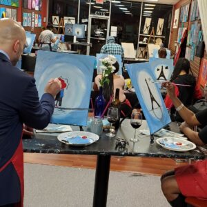 A Couple Painting A Portrait At Valentine'S Paint And Sip Class In Cary, Nc At Cheers N Paint Art Studio.