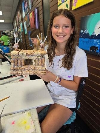 Summer Art Camp Student With Art Creation In Cary, Nc