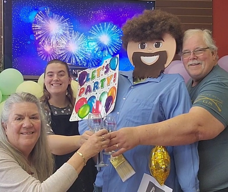 Owners of Cheers N Paint art studio celebrating business anniversary