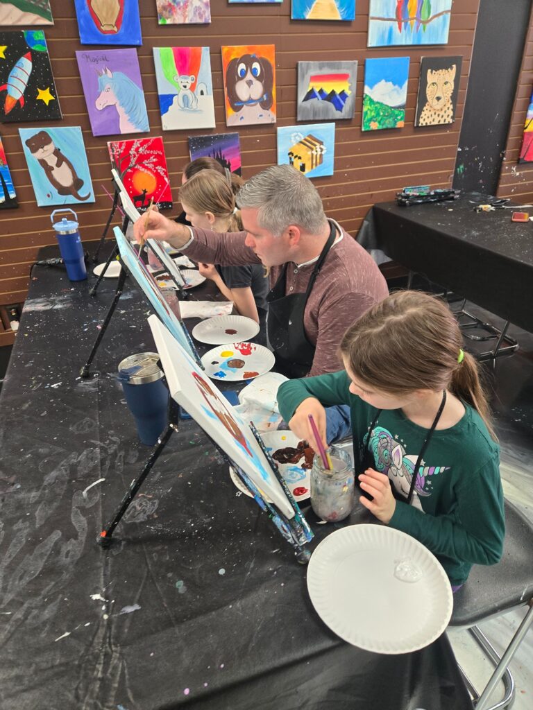 Family Painting Together At Cheers N Paint Art Studio