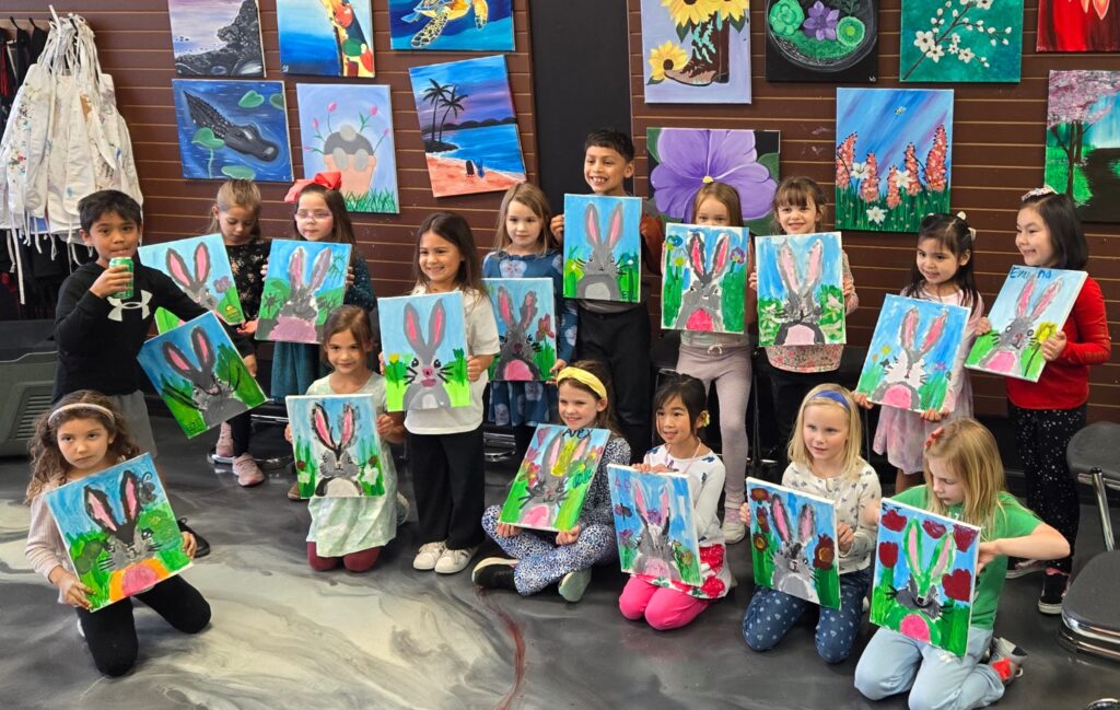 Girls Art Birthday Party In Cary Nc At Cheers N Paint, Painters Holding A Bunny Painting With Friends