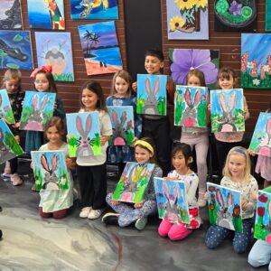 Girls Art Birthday Party In Cary Nc At Cheers N Paint, Painters Holding A Bunny Painting With Friends