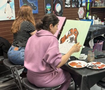 painting canvas in Cheers N Paint art studio