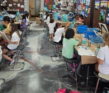 Summer art camp in Cary NC with students painting