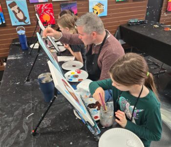 family painting together at Cheers N Paint art studio